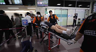 Güney Kore'de uçuş sırasında kapıyı açan yolcu gözaltına alındı