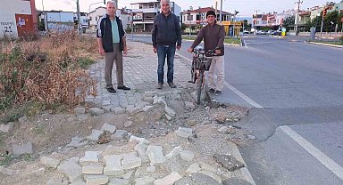 Burhaniye'de bozuk kaldırım kazaya davetiye çıkarıyor