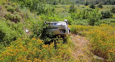 Takla atan otomobilden burnu bile kanamadan kurtuldu