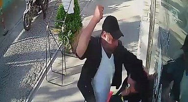 Tartıştığı kadını sokak ortasında darp etti