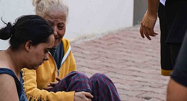 Antalya'da 4 katlı dairede yangın paniği, yaşlı kadını kurtaran kurye dumandan etkilendi