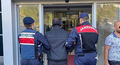 Hırsızlık suçundan aranan zanlı ateşin başında ısınırken yakalandı