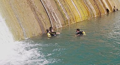 Sulama havuzu bendinde mahsur kaldı, dalgıçlar kurtardı