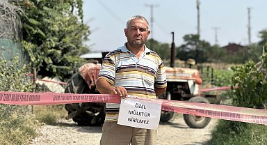 Tapulu arazisindeki yola 'özel mülk' yazısı asıp, ulaşıma kapattı