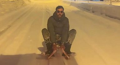 Otomobilin arkasına bağlanan kızakla kaydı